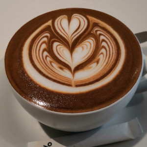 A dark Mochaccino with a heart pattern