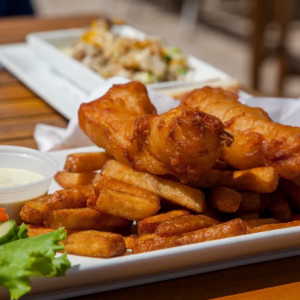 Fish and chips with a fresh lemon salad