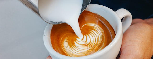 Golden latte coffee with a rippled pattern